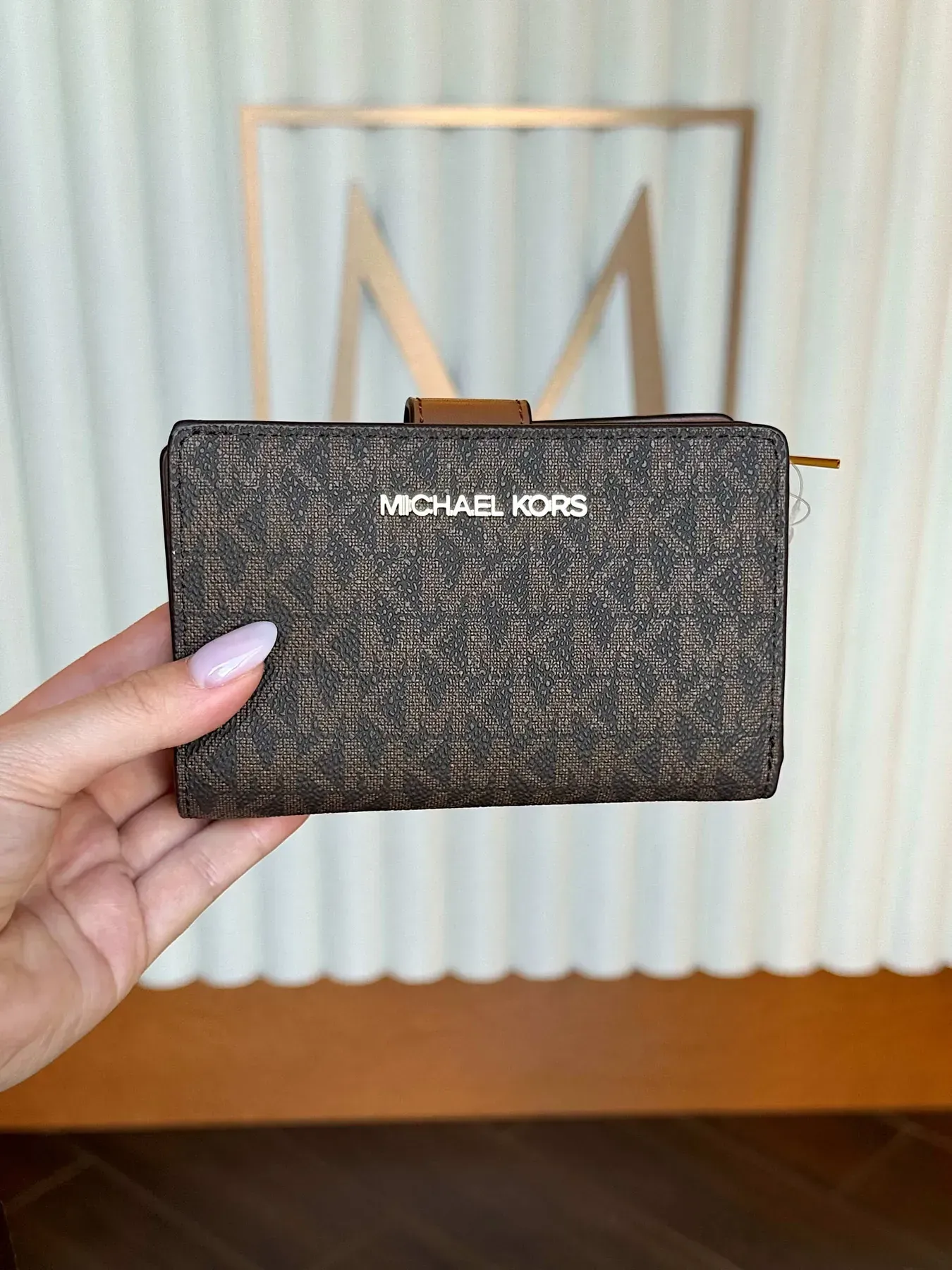 Малий жіночий гаманець Michael Kors коричневий із логотипним принтом
